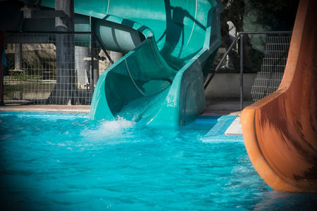 Details of blue and orange slides in an aqua park