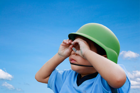 Asian boy Use both hands to make a telescope. clipping path
