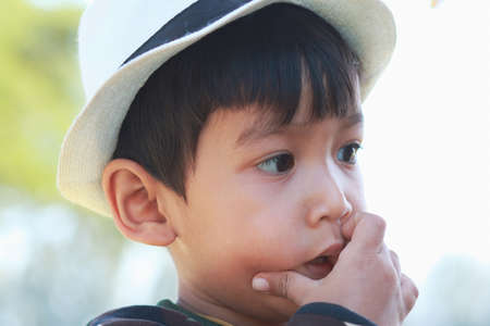Close-up of an Asian boy face His face showed curiosity.の写真素材