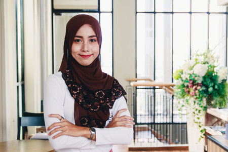 Portrait of a beautiful Muslim woman wearing hijab .Her face is smiling
