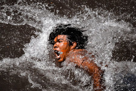 Indigenous young indian from an Amazon tribe in Brazil, swimming for the indigenous games...