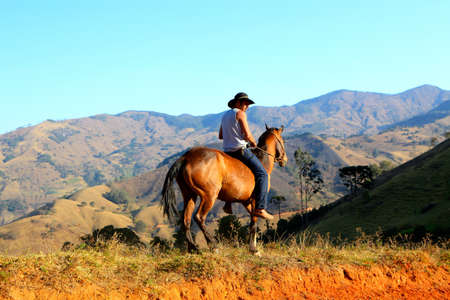 Farm man riding horse on indigenous peoples' land in the Brazilian Amazon. 2007.のeditorial素材
