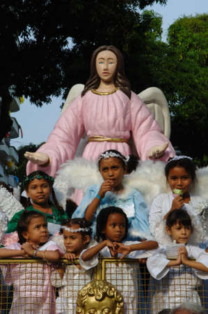 Children wearing angel costumes at CÃ­rio de NazarÃ©, the largest Marian procession of the world, which happens every October in BelÃ©m, ParÃ¡, Amazon, Brazil. October, 2005.のeditorial素材