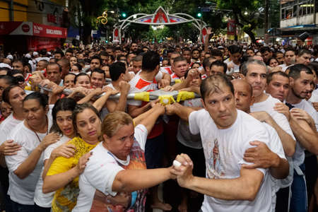 Crowd of people following the statue of Our Lady of Nazareth at CÃ­rio de NazarÃ©, the largest Marian procession in the world, which happens every October in BelÃ©m, ParÃ¡, Amazon, Brazil. October, 2015.のeditorial素材