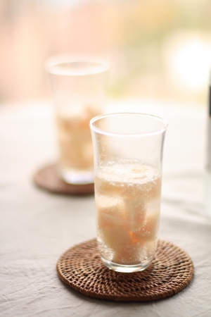 Japanese summer soda alcohol cocktail drink with peachの写真素材