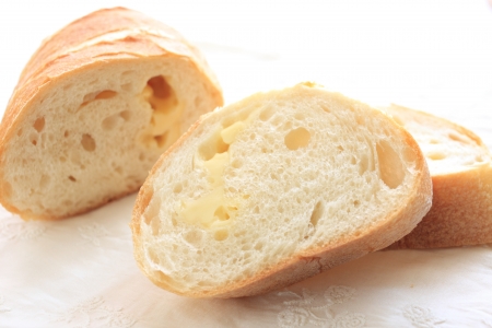 sliced cheese baugette on white backgroundの写真素材