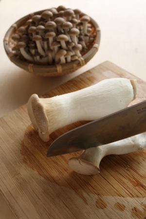 Japanese mushroom Eringi on wooden chopping boardの写真素材