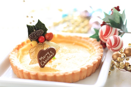 christmas cheese cake with ornamentの写真素材