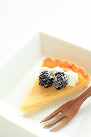 home bakery, cheese pie with black berry on topの写真素材