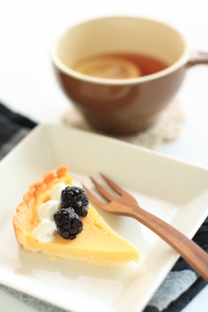 home bakery, cheese pie with black berry on top の写真素材