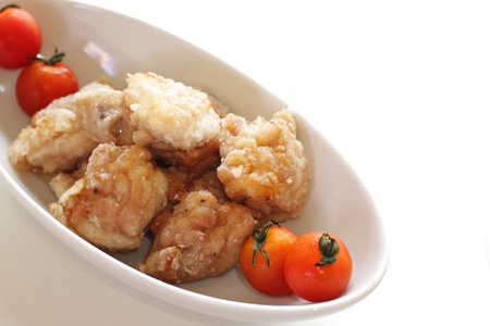 Japanese cuisine, fried chicken served with cherry tomatoの写真素材