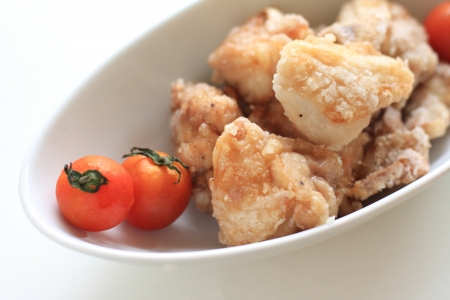 Japanese cuisine, fried chicken served with cherry tomatoの写真素材