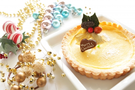 Christmas dessert, home bakery custard pie with ornamentの写真素材