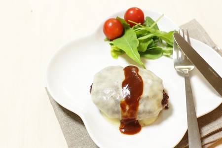 homemade cheese hamburger with salad on sideの写真素材
