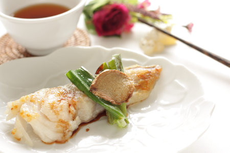 chinese cuisine, fried codfish with leek and ginger