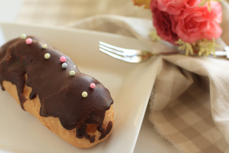 french cuisine, eclair with chocolate for gourmet desset image