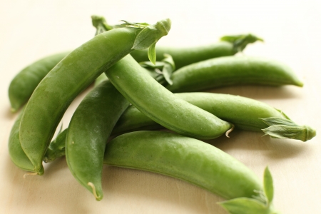 japanese summer vegetable, snap pea on wooden tableの写真素材
