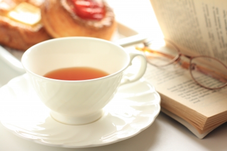 english tea and pastry for gourmet breakfast image with novel on sideの写真素材