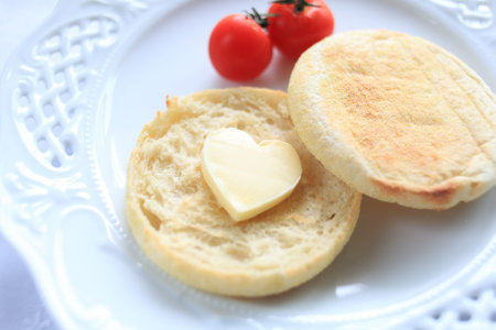 heart shaped butter and english muffinの写真素材