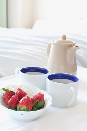 strawberry and coffee on bed side for home interior imageの写真素材