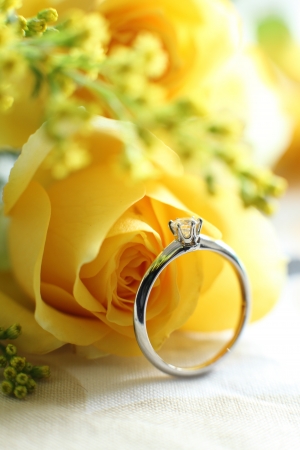 Diamond ring and yellow roseの写真素材