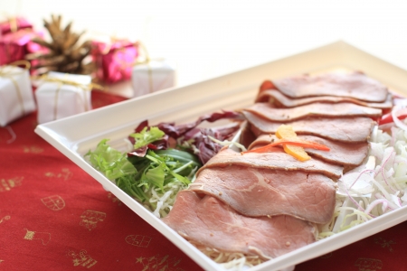Sliced roast beef on food container for Christmas food imageの写真素材