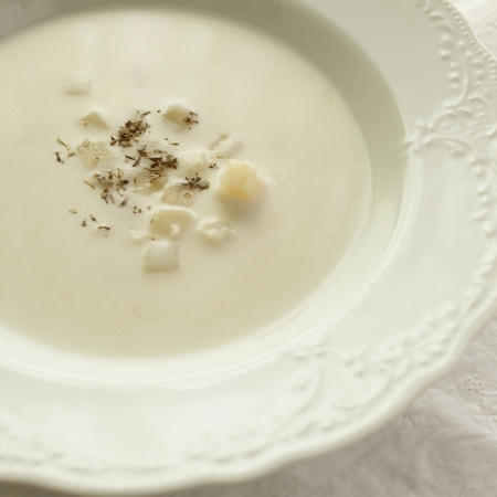 creamy potato soup with dried herbal on topの写真素材