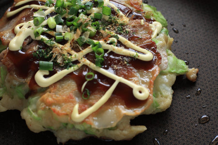 Japanese food, cooking of Okonomiyakiの写真素材