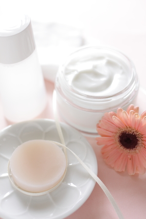 beauty soap and gerbera flower on white backgroundの写真素材