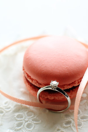 close up of pink macaroon and diamon ringの写真素材