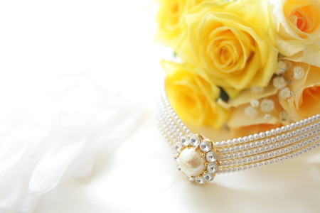 Yellow roses bouquet and weddeing accessorisの写真素材