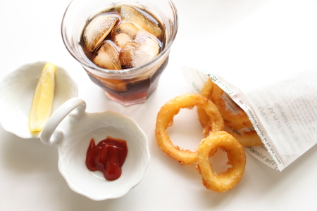 fried onion and cola for junk food imageの写真素材