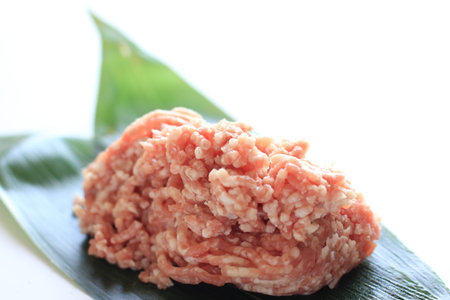 Mince pork on green leaf for food ingredient image