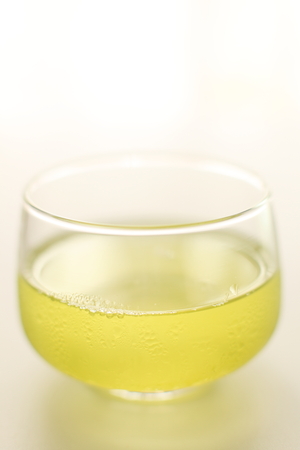 iced green tea on wooden table with copy spaceの写真素材