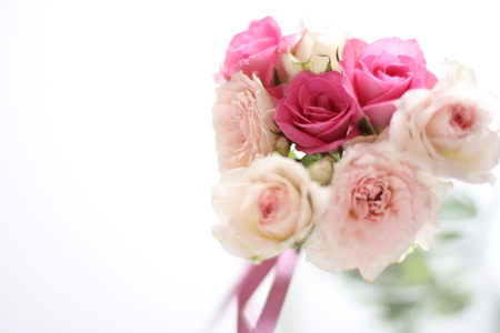 Elegant pink roses bouquet on white background for wedding imageの写真素材