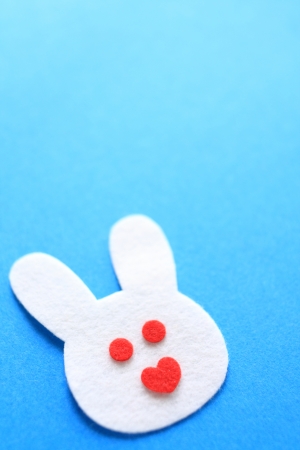 Handmade ribbit on blue backgroundの写真素材