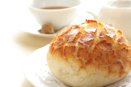 home bakery cheese bread with english tea on background