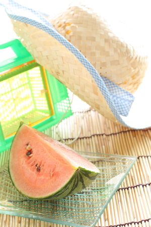 cut friut, watermelon and hat for summer imageの写真素材