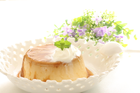 Custard pudding with mint and caramel sauceの写真素材