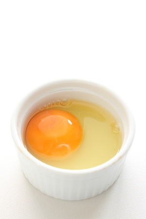 freshness raw egg on white bowl with copy spaceの写真素材
