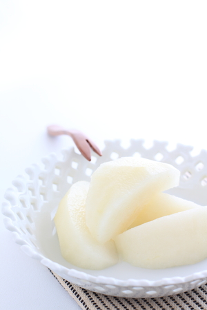 Japanese autumn fruit, cut pearl on dishの写真素材