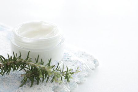 facial cream and rosemary on towel for skincare cosmetic imageの写真素材