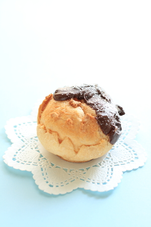 Home bakery, puff cream with chocolate coatingの写真素材