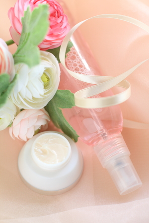 facial moisturizer and lotion with flower for beauty imageの写真素材