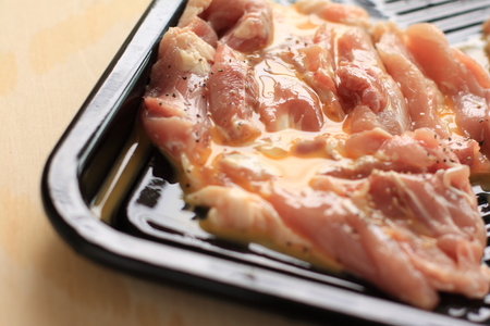 chicken tight with egg wash on grill panの写真素材