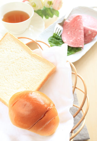 Salami sausage and bread with tea