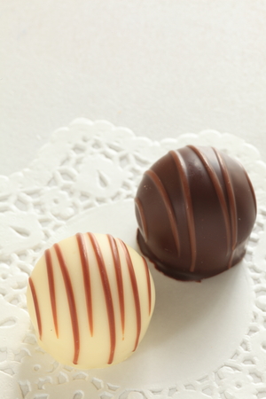 chocolate on lace paperの写真素材