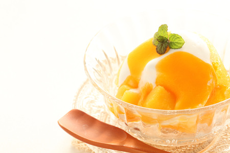 mango and vanilla ice cream with mintの写真素材
