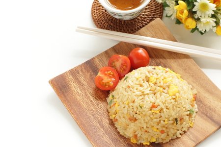 Chinese fried rice served wtih cherry tomatoの写真素材