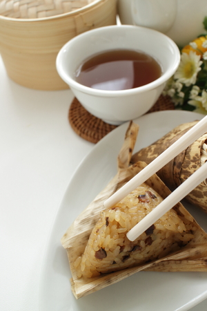 Chinese food, sticky rice in leaf steamed Zongziの写真素材
